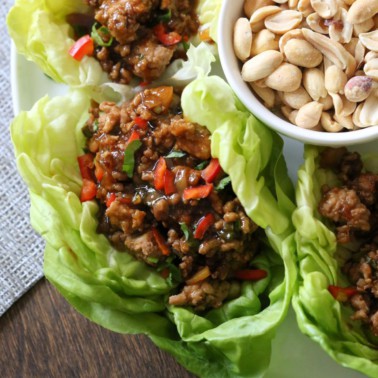 lettuce leaves full of ground turkey with sauce and green onions