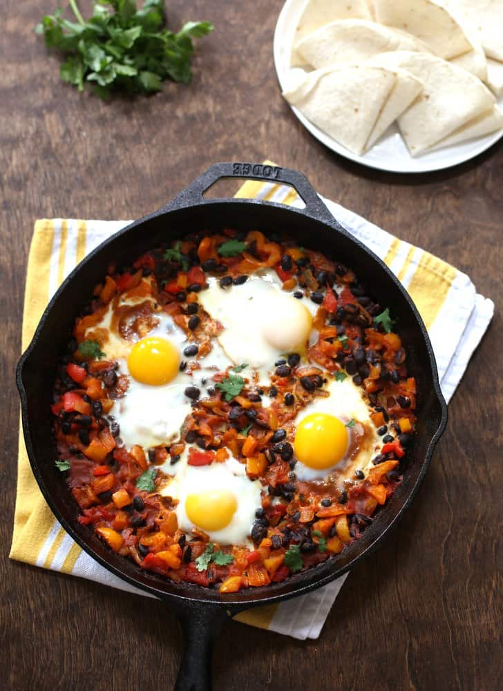 eggs and vegetables in a cast iron skillet