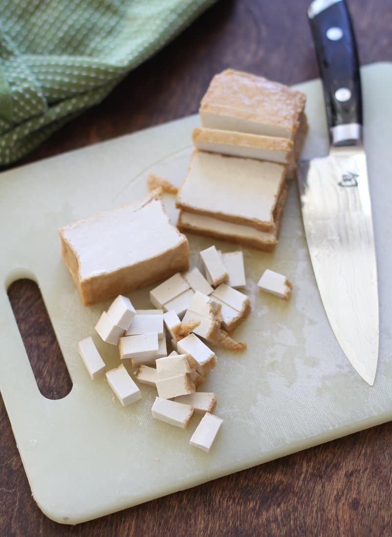 cutting Extra Firm Tofu on a cutting board