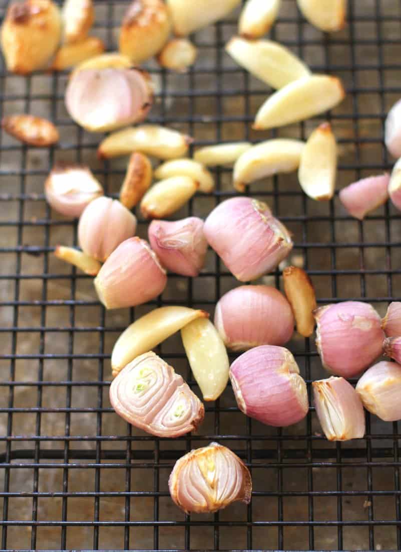 overhead image of Roasted Garlic and Shallots on a cooling rack