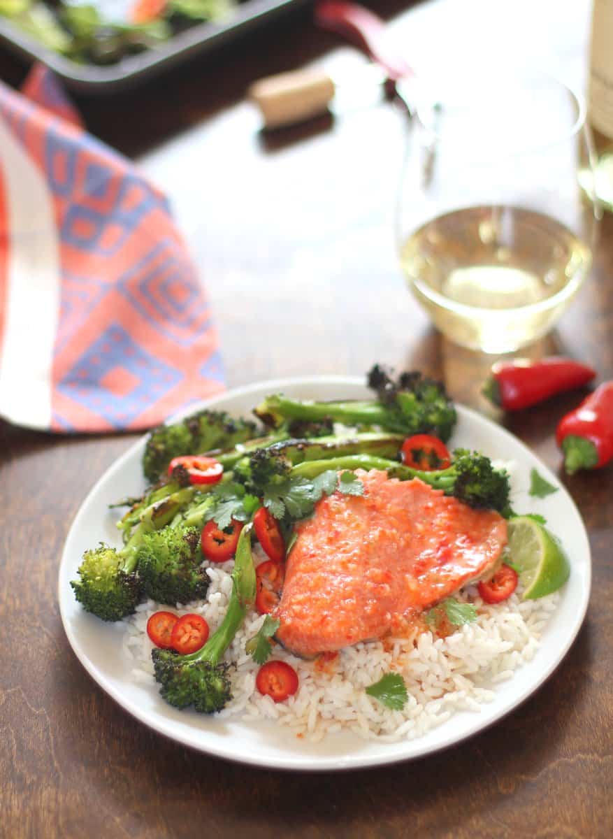 salmon, broccoli and rice on a white plate