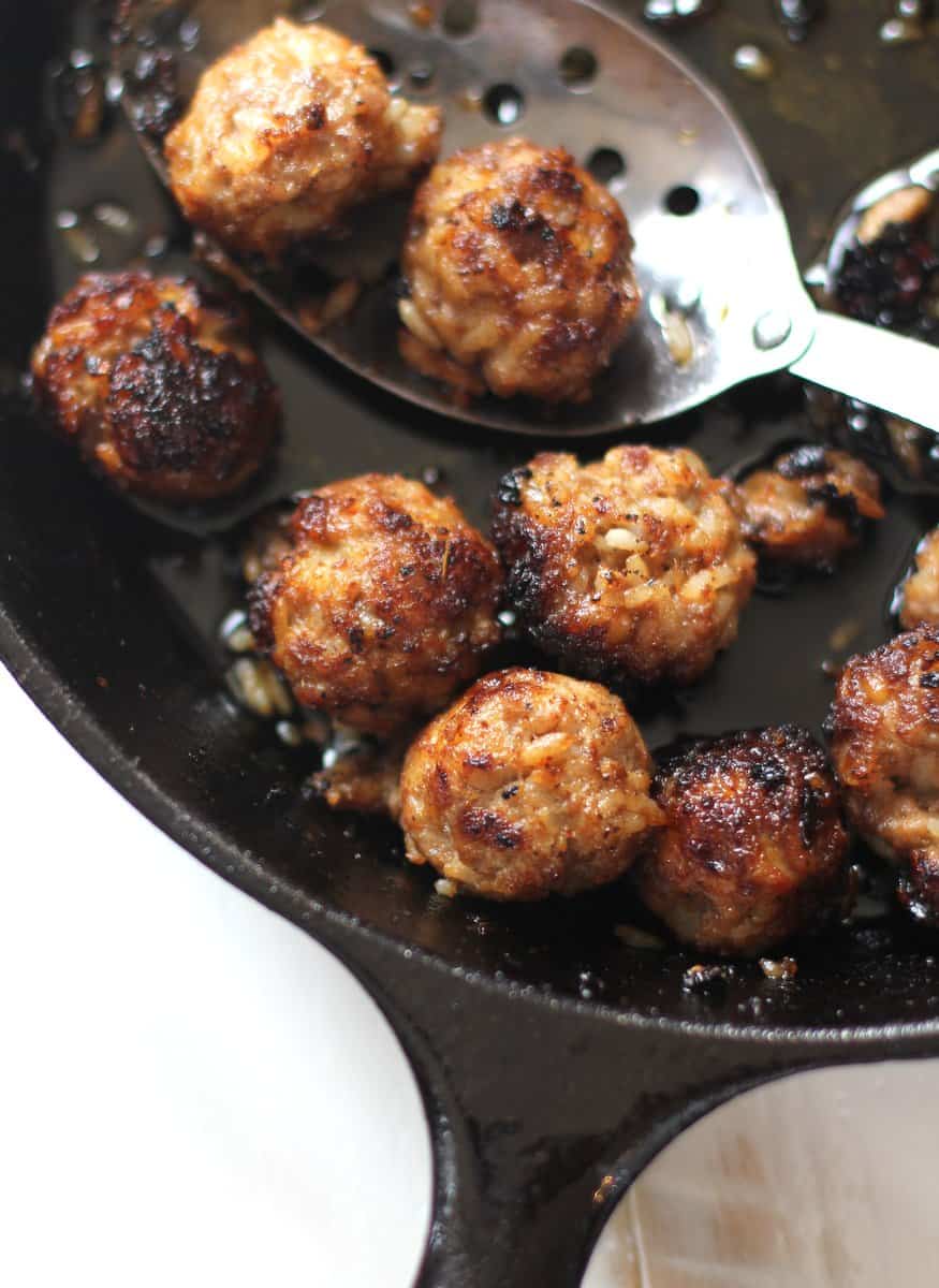 Thai Meatballs with Pork and Rice in a cast iron skillet