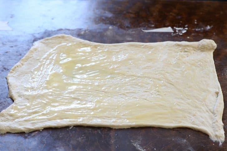 raw pizza dough with butter