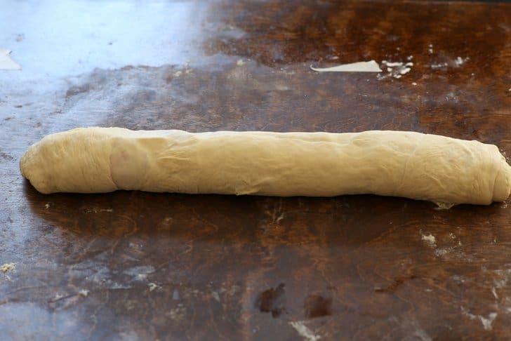 ham and cheese pizza dough rolled into a log