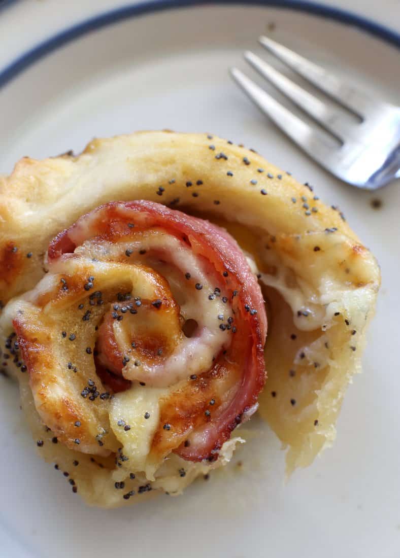 close up image of a Baked Ham and Cheese Roll on a white plate