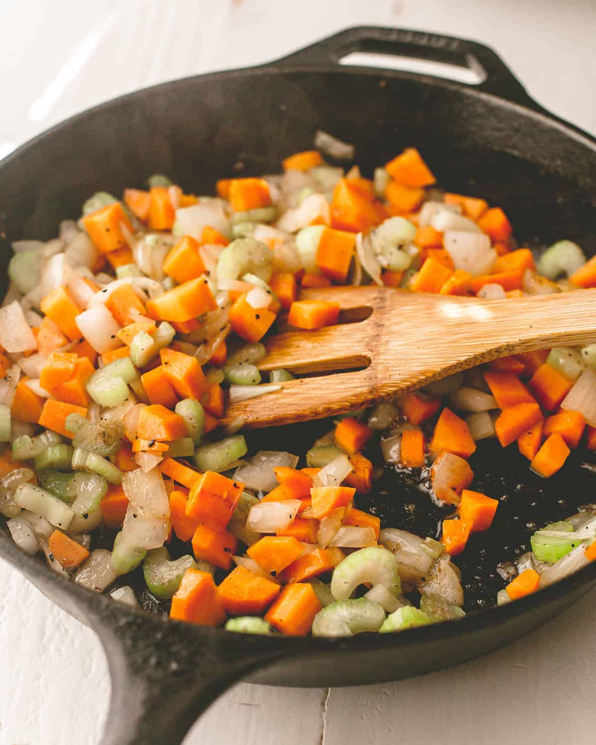 sauteeing vegetables in a cast iron skillet