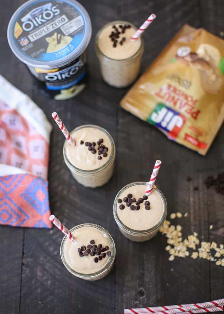 overhead image of Smoothies in mason jars on a wooden table