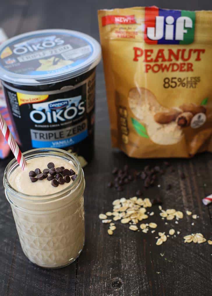 Peanut Butter Chocolate Oat Smoothie in a glass jar on a wood table