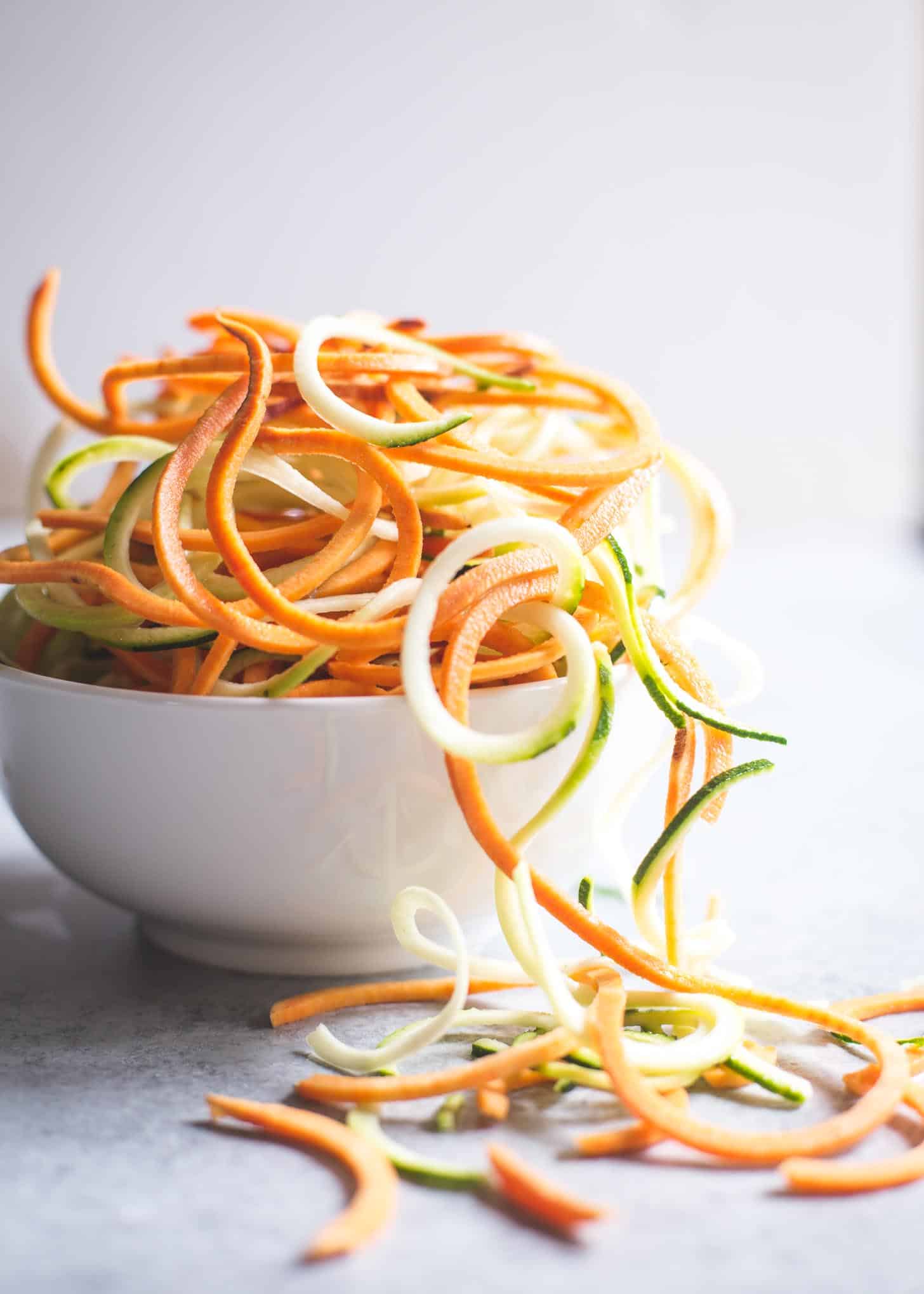 Zucchini and Sweet Potato Zoodles in a white bowl