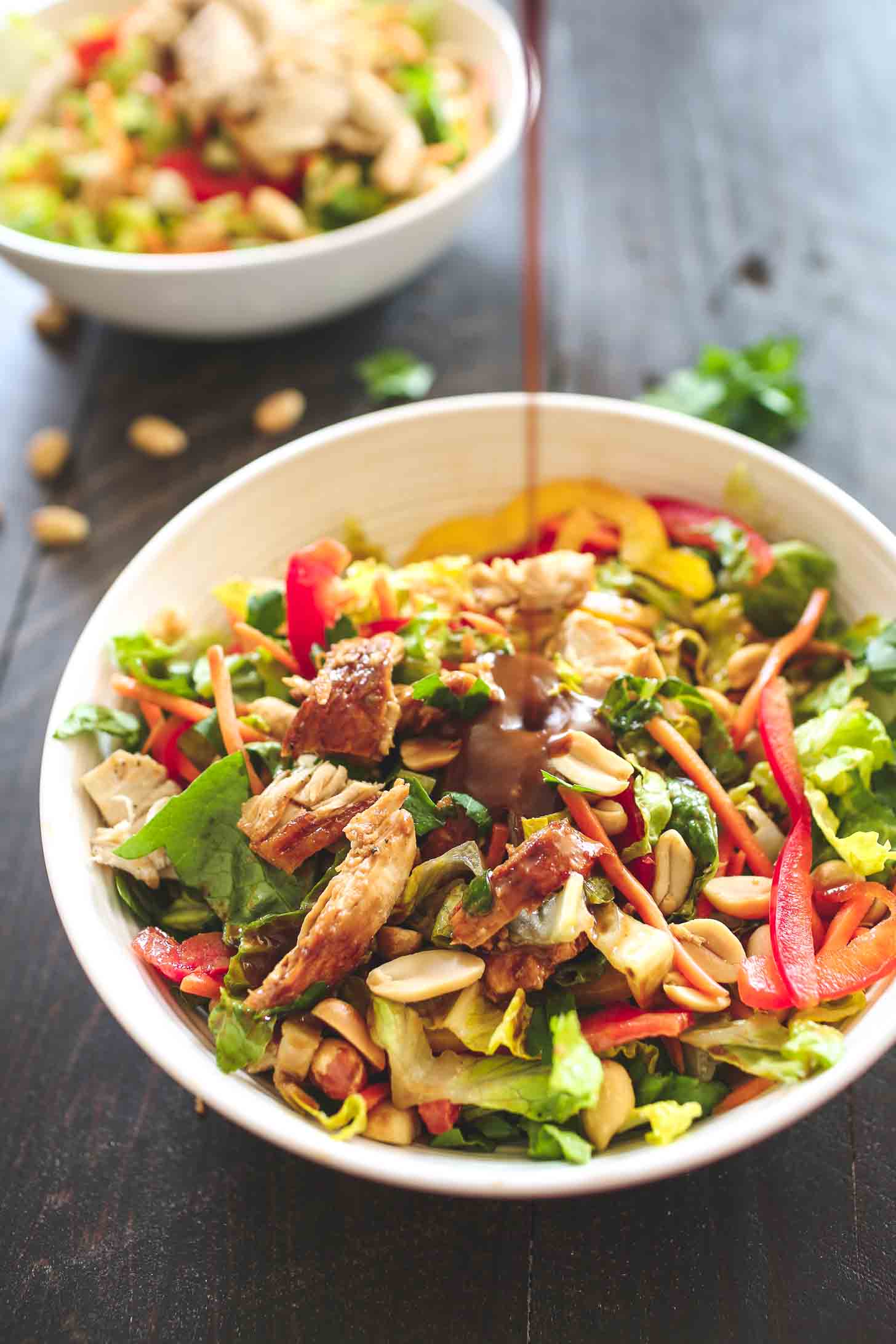 adding peanut dressing to Chopped Chicken Salad