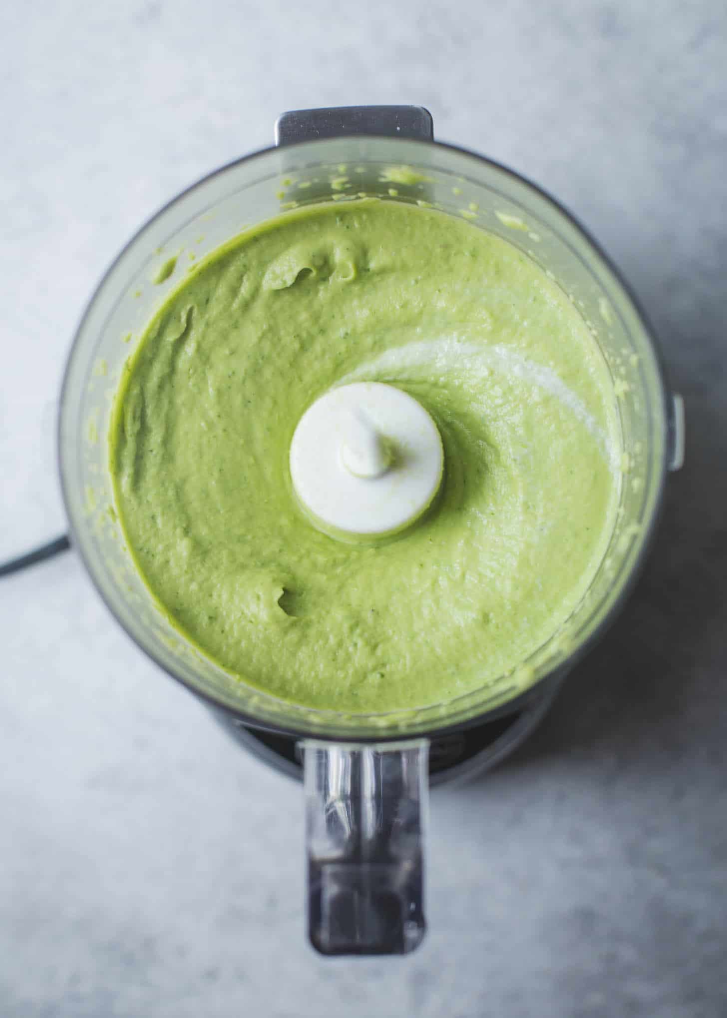 overhead image of Avocado Crema in a food processor