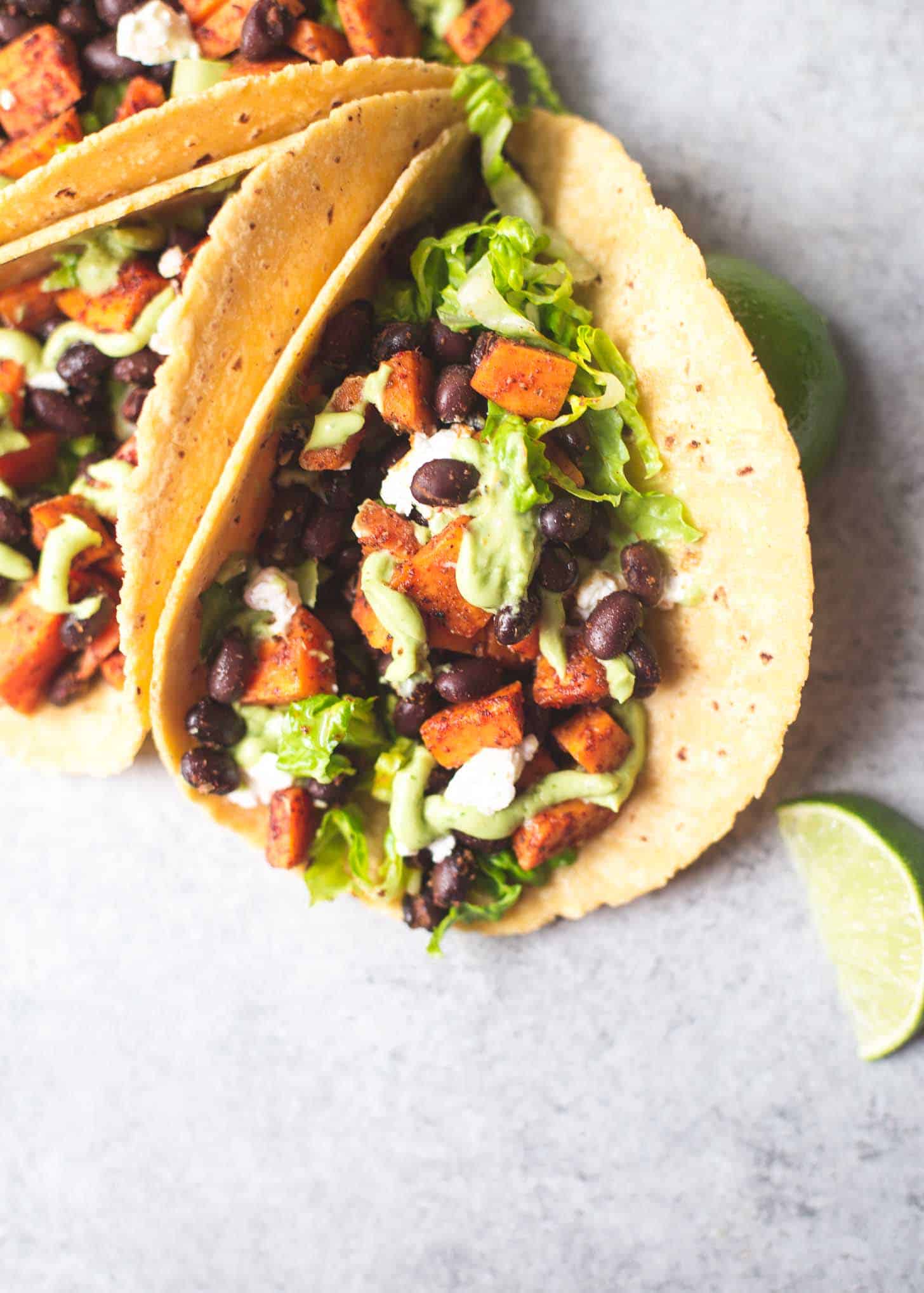 overhead image of sweet potato tacos on a grey countertop