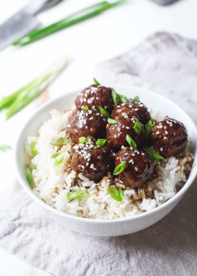 Hoisin Meatballs over rice in a white bowl