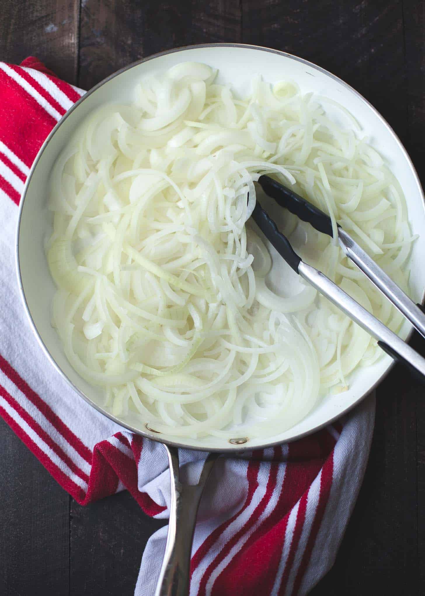 sliced onions in a skillet