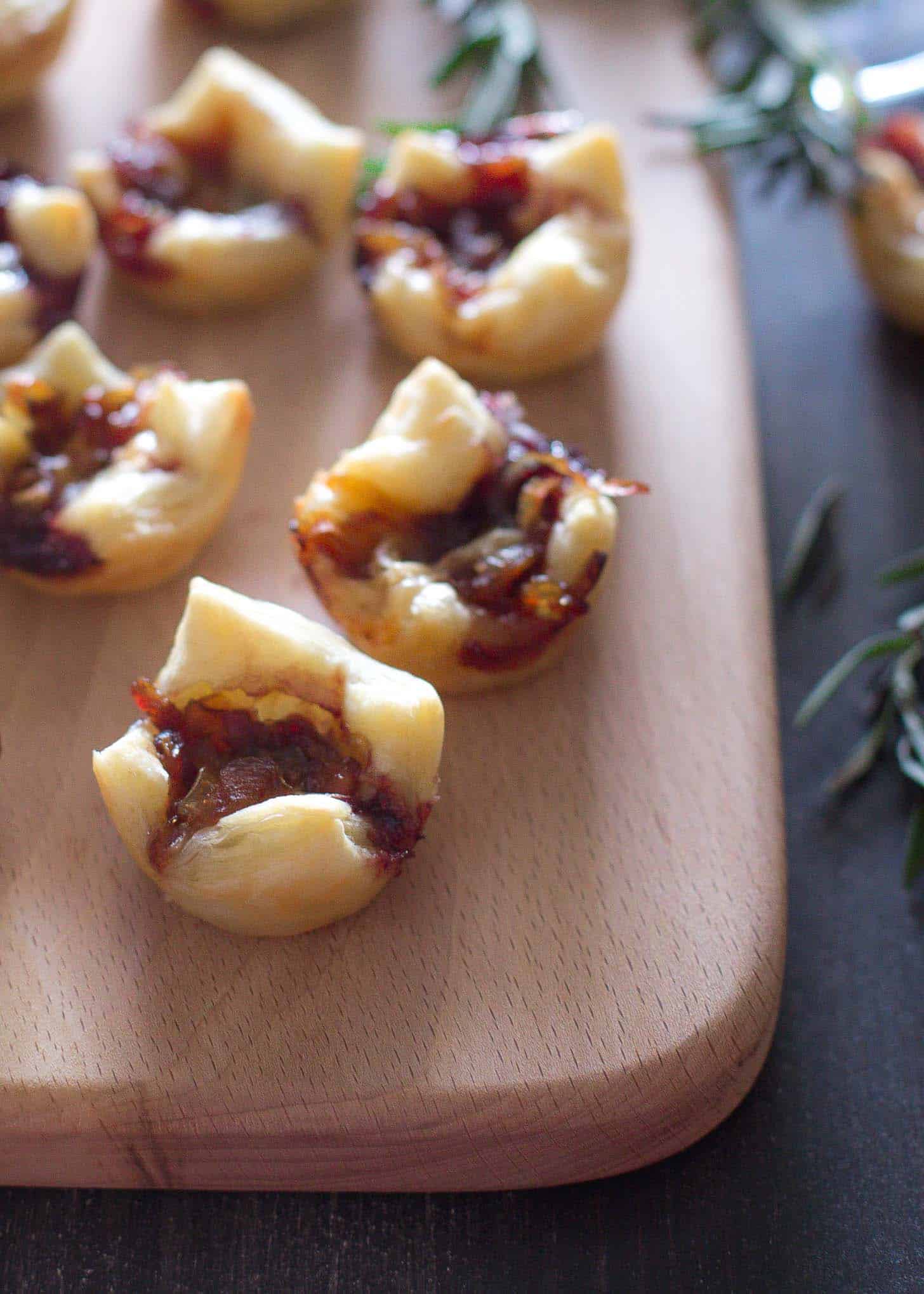 puff pastry bites on a wooden tray