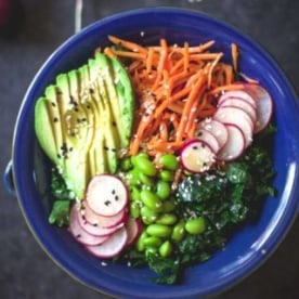 kale salad in a blue bowl