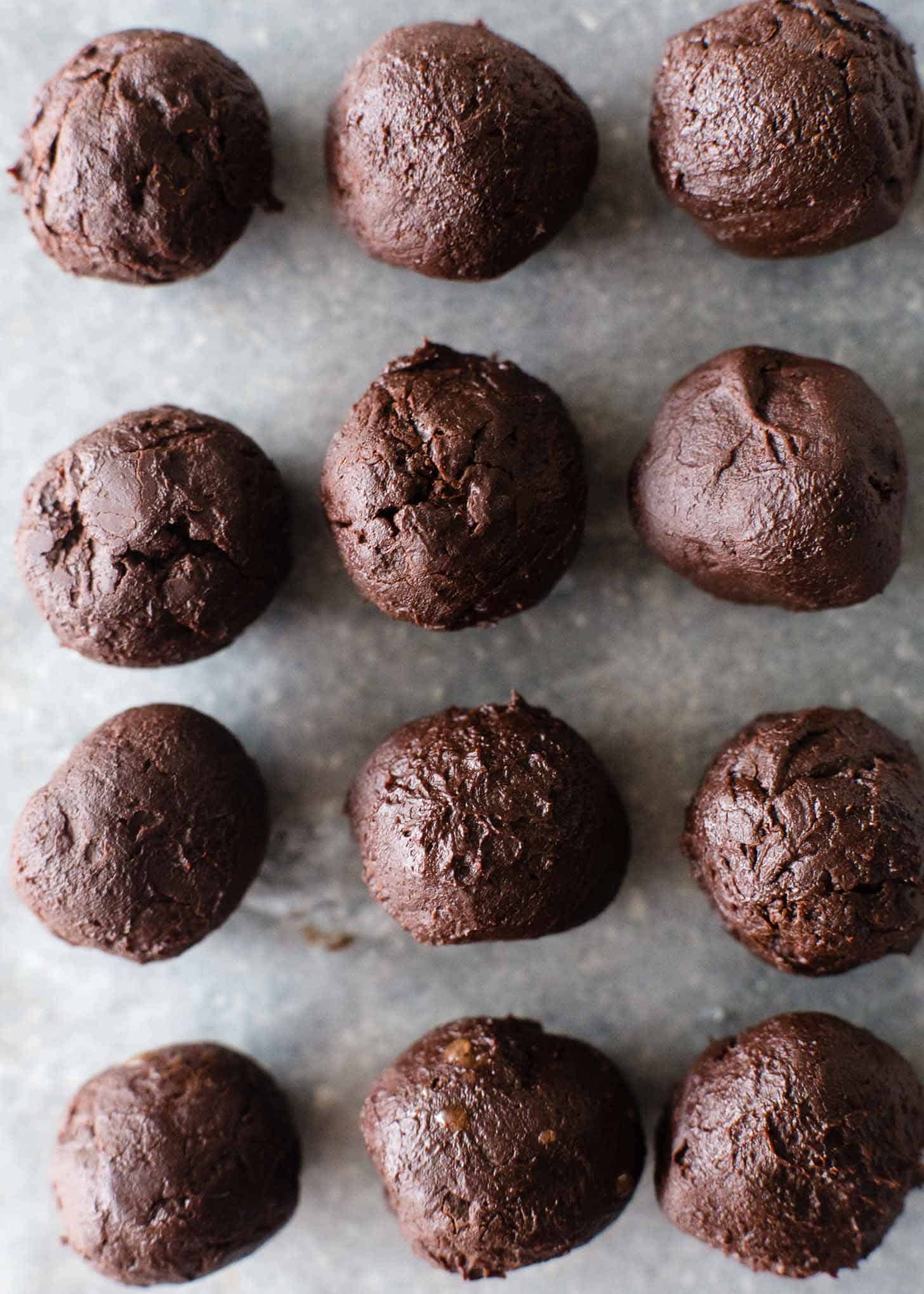 Chocolate truffles on a sheet of parchment paper