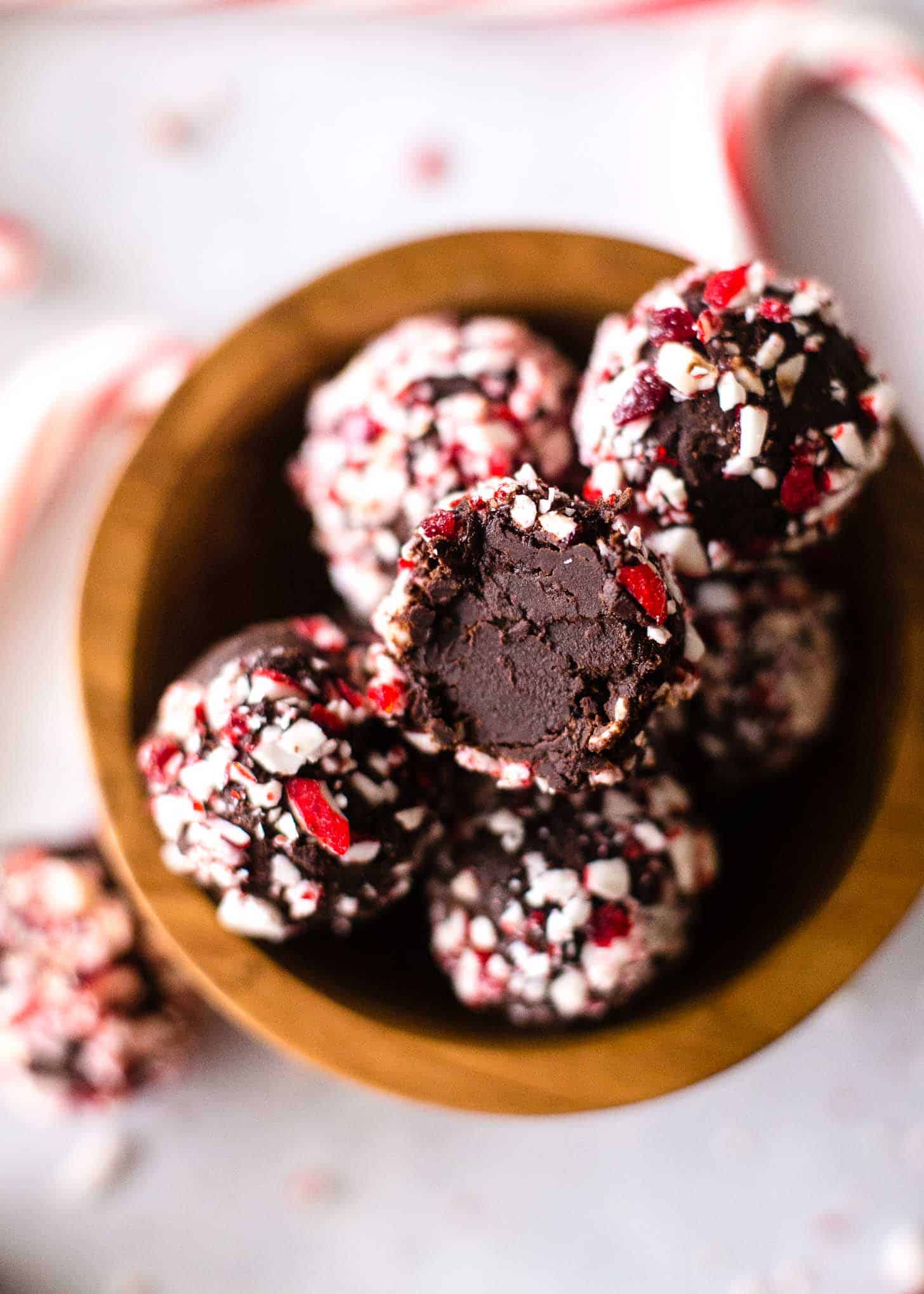 Chocolate Candy Cane Truffles in a small wooden bowl