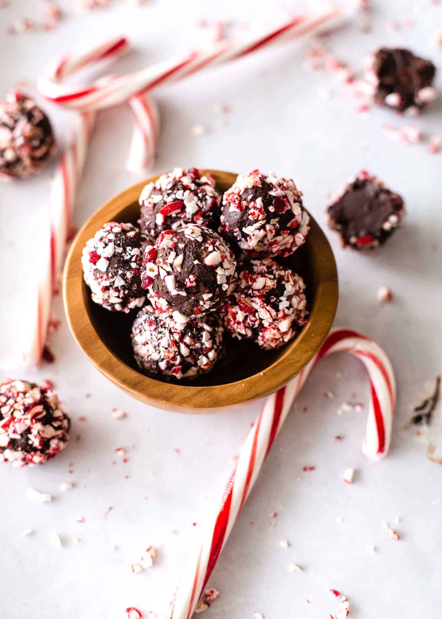 Chocolate Candy Cane Truffles in a small wooden bowl