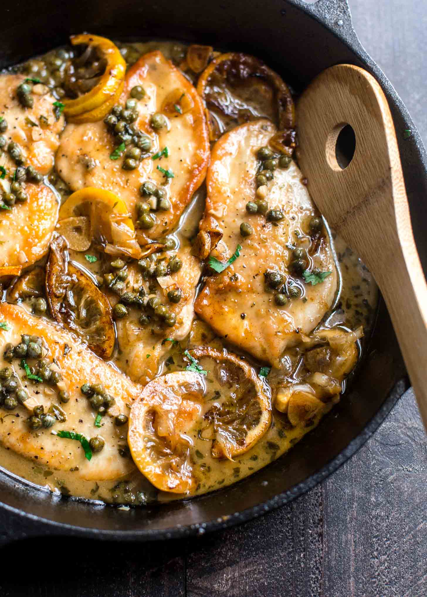 cooking chicken picatta in a cast iron skillet