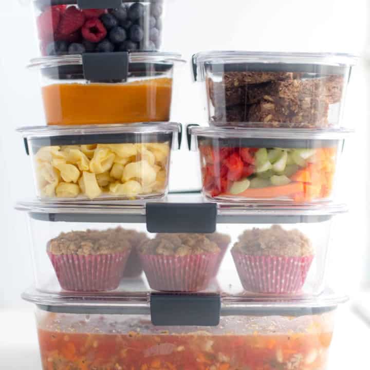 clear containers stacked and filled with prepped ingredients