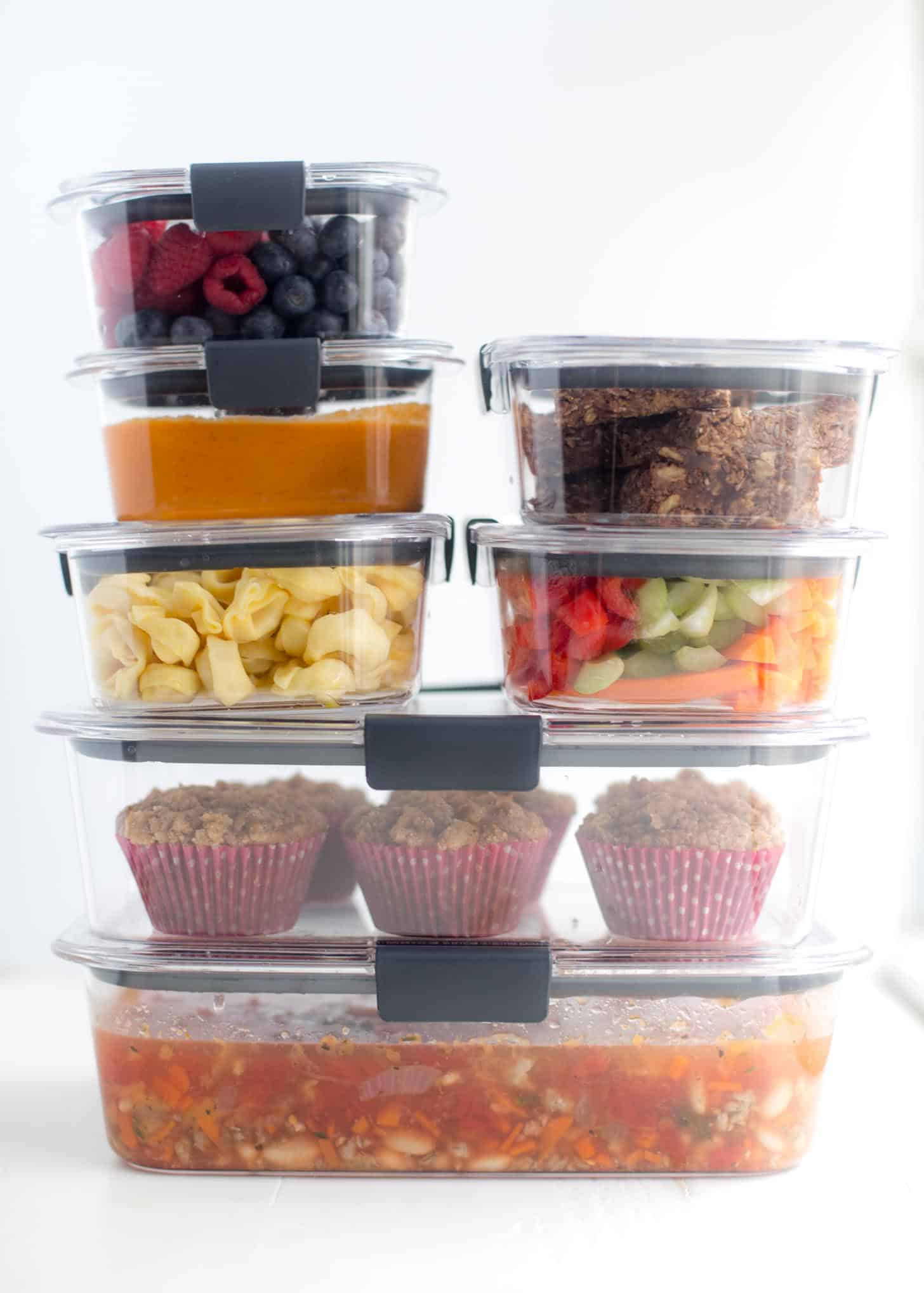 food prepped in clear glass containers, stacked on top of one another