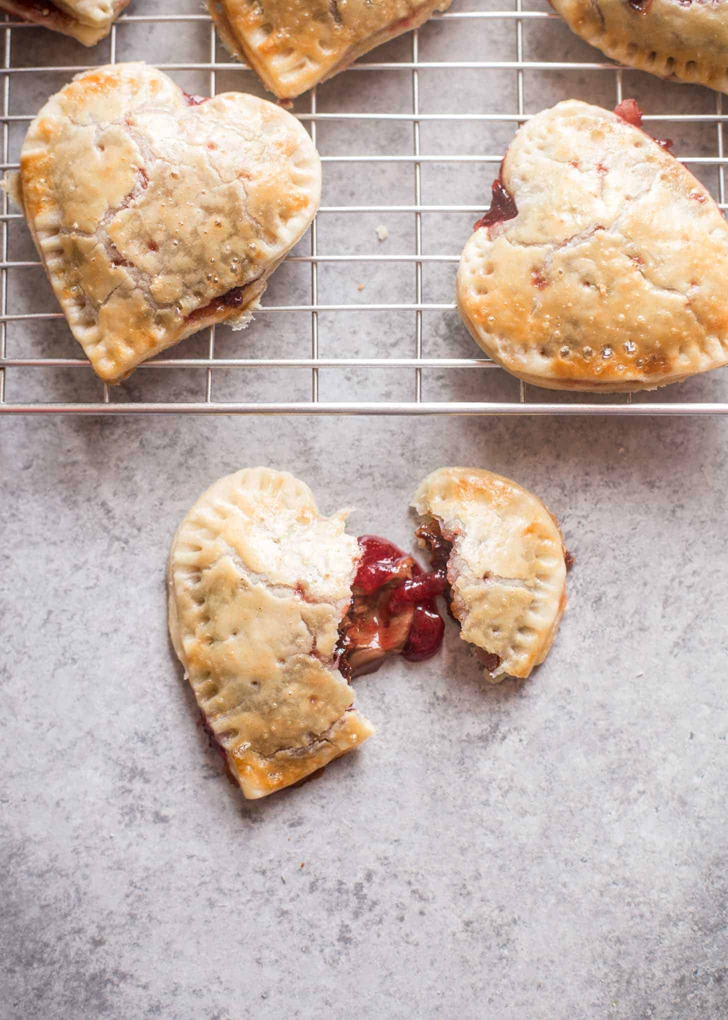 heart-shaped Strawberry Hand Pies on a wire rack
