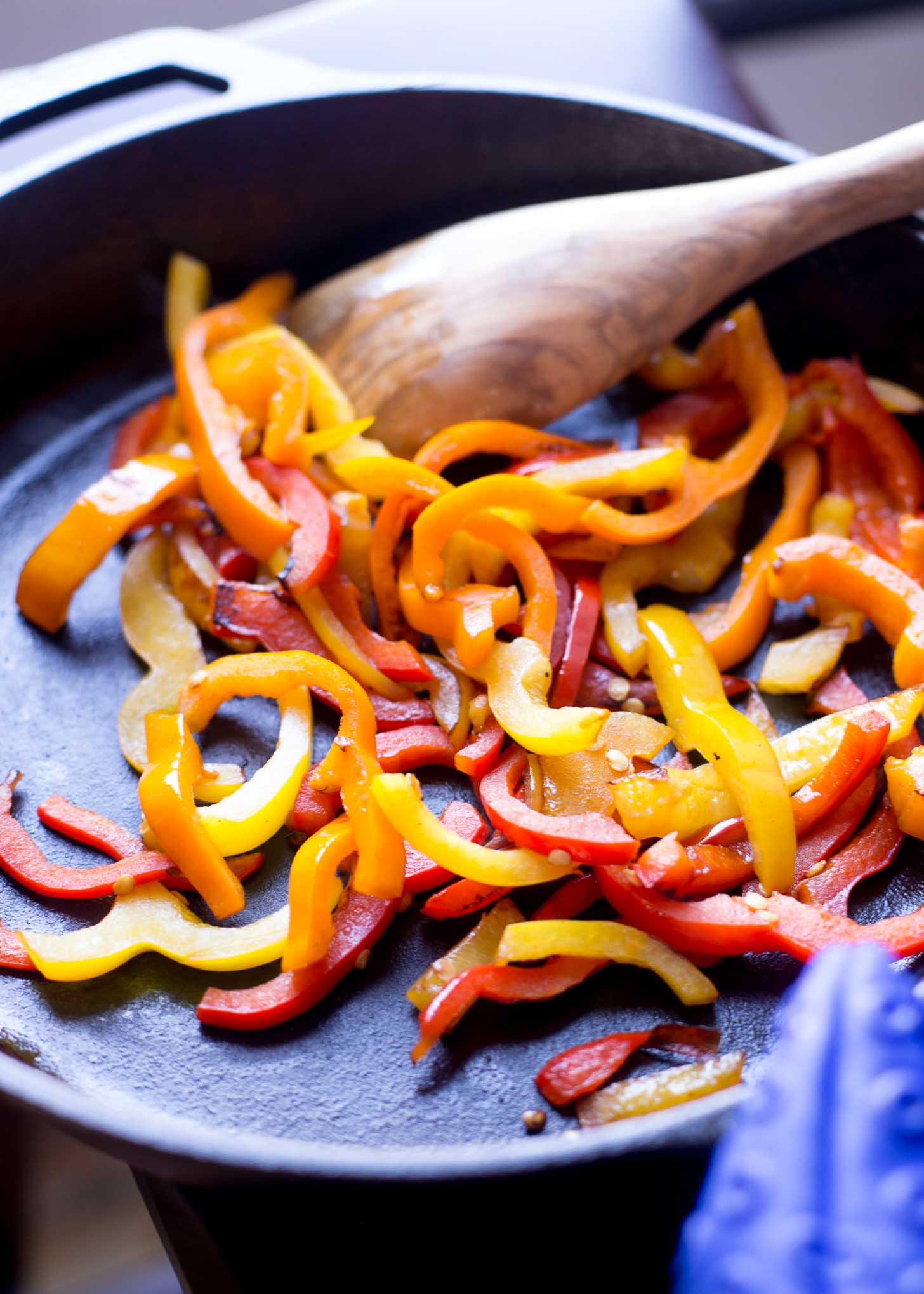 cooking bell peppers in a skillet