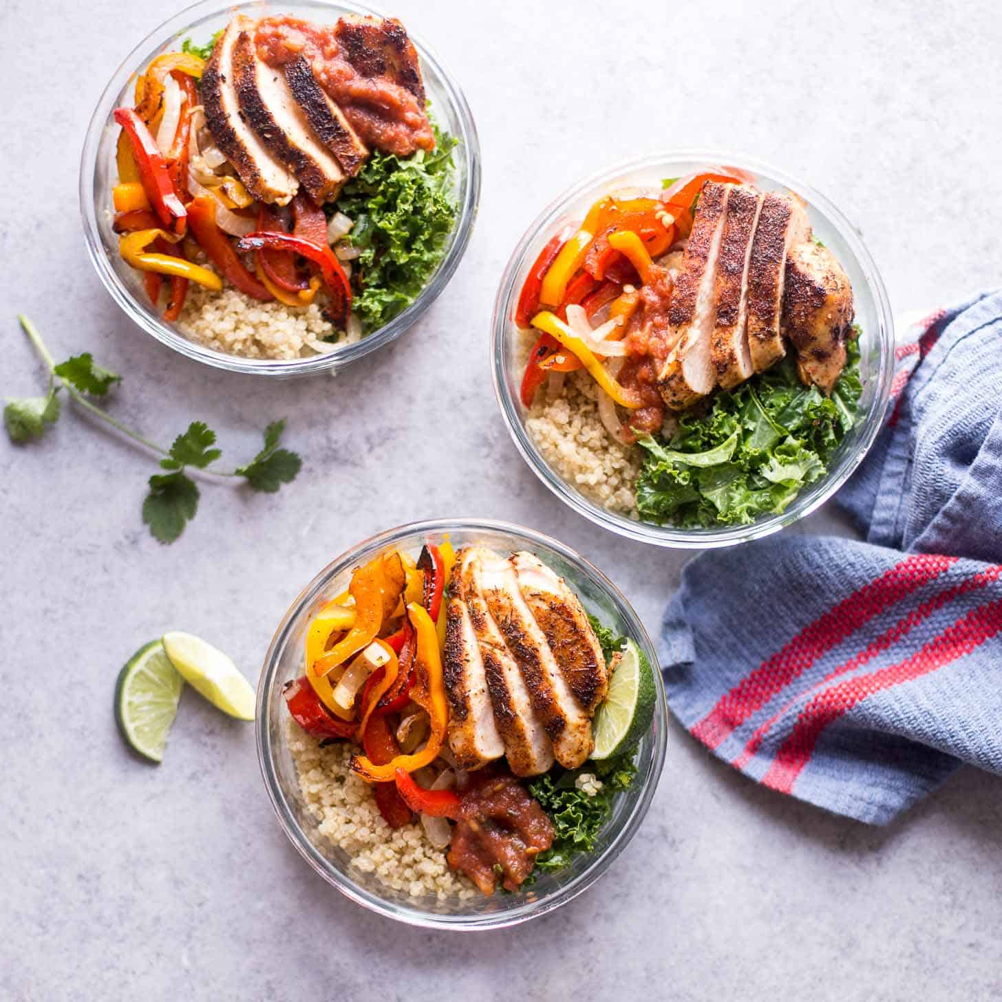 Chicken Fajita Quinoa Bowls on a white table