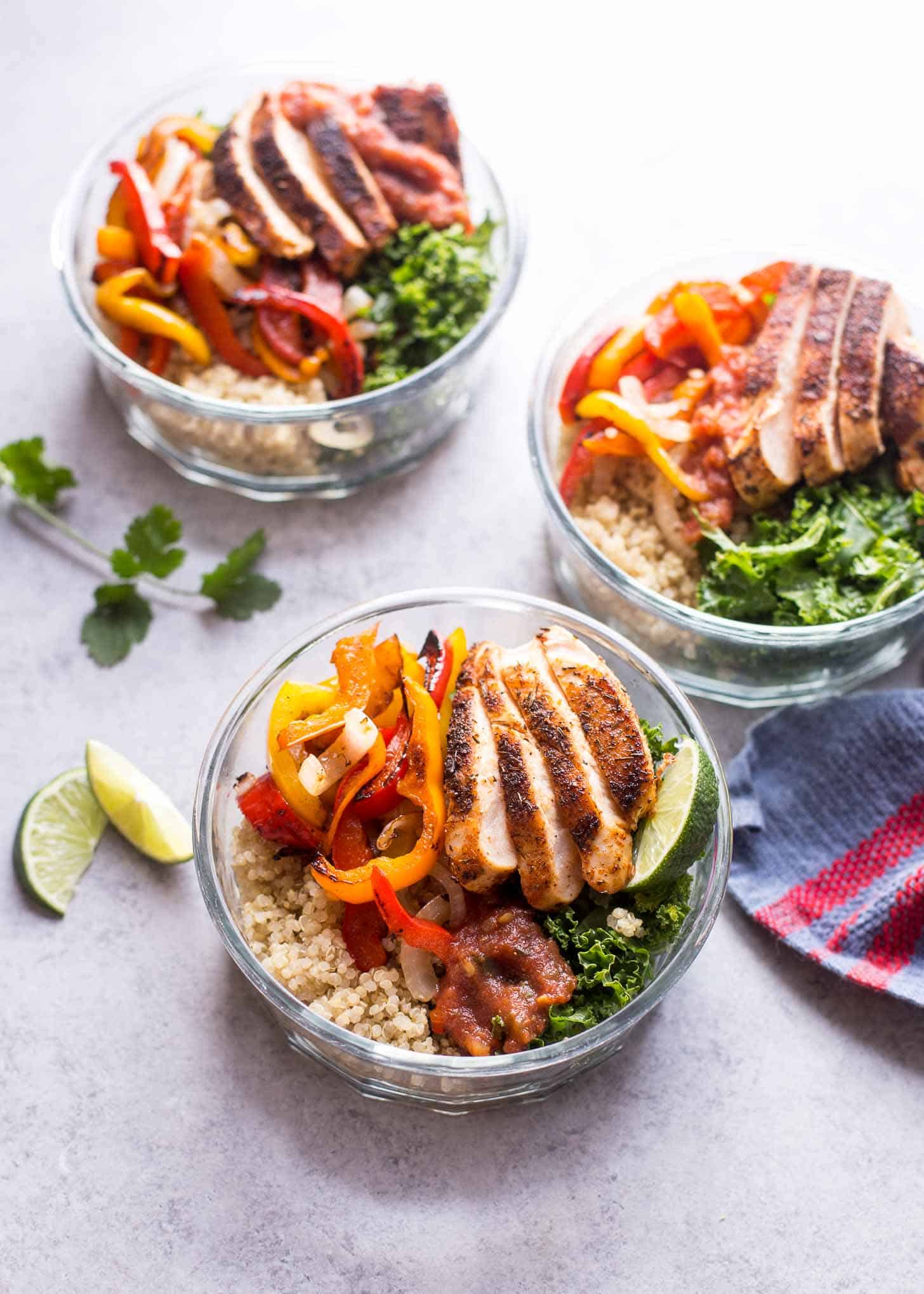 Chicken Fajita Quinoa Bowls on a white tabletop