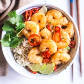 honey lime shrimp in a bowl over rice