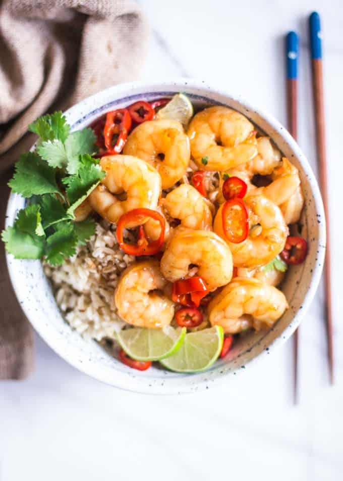 honey lime shrimp in a bowl over rice