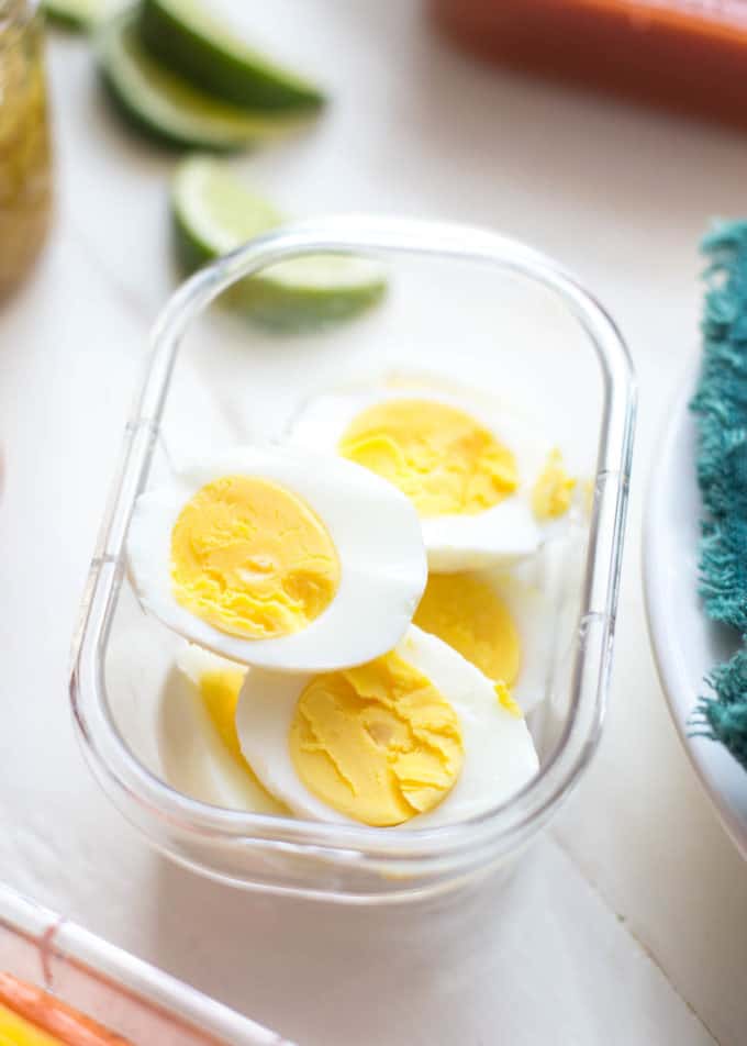 sliced boiled eggs in a container