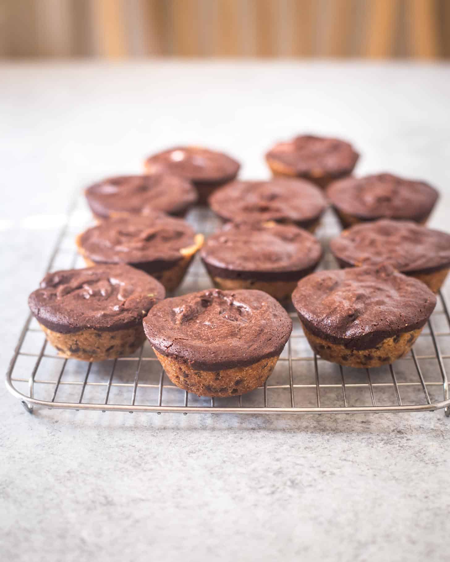 Thick and Chewy Chocolate Chip Cookie Brownies on a wire cooling rack