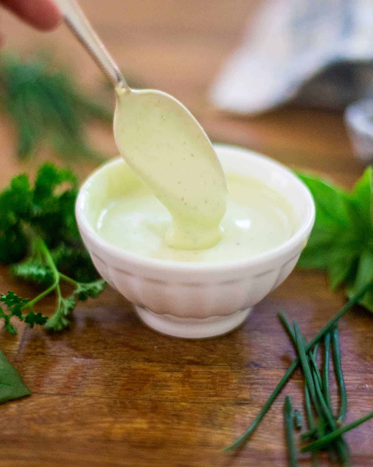 Creamy Herb Yogurt Dressing in a small white bowl