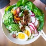 spring cobb salad in white bowl