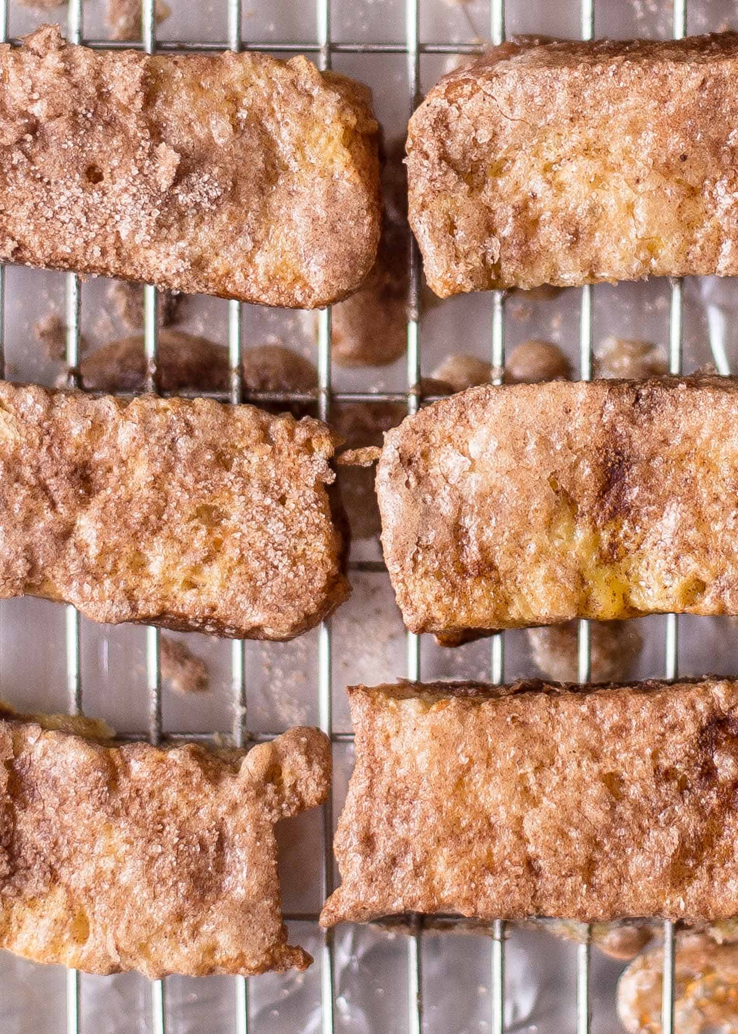 overhead image of Baked Cinnamon French Toast Sticks on a cooling rack