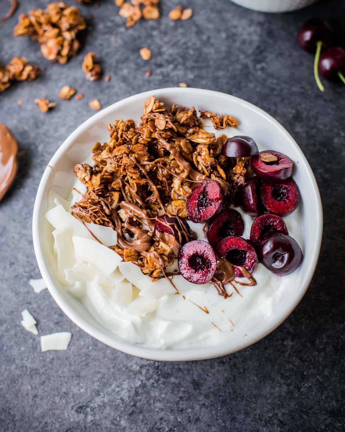 Nutella Granola with cherries in a white bowl