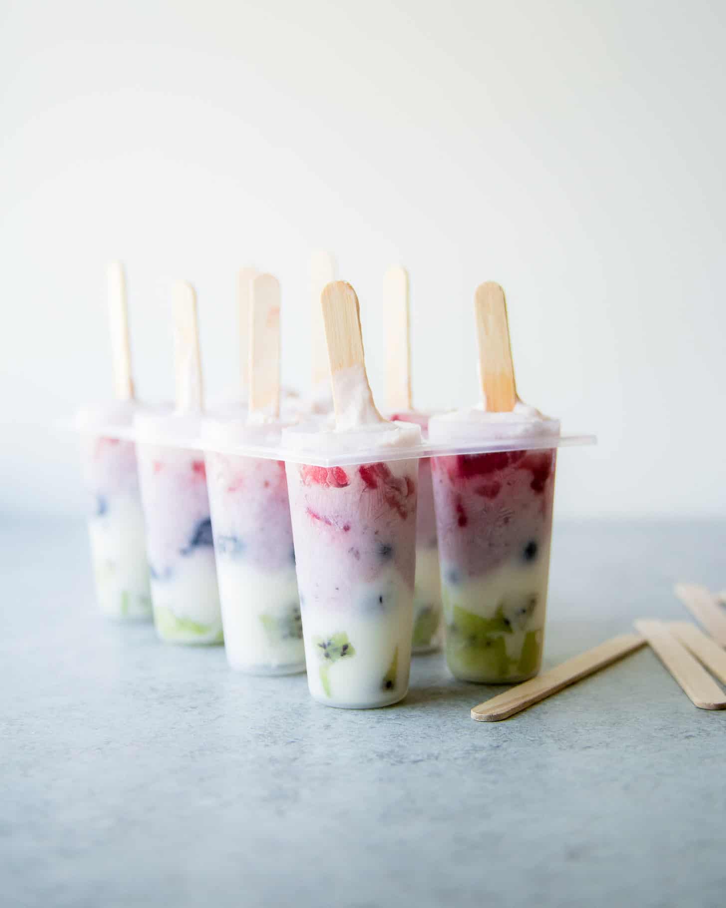 Rainbow Yogurt Popsicles in molds