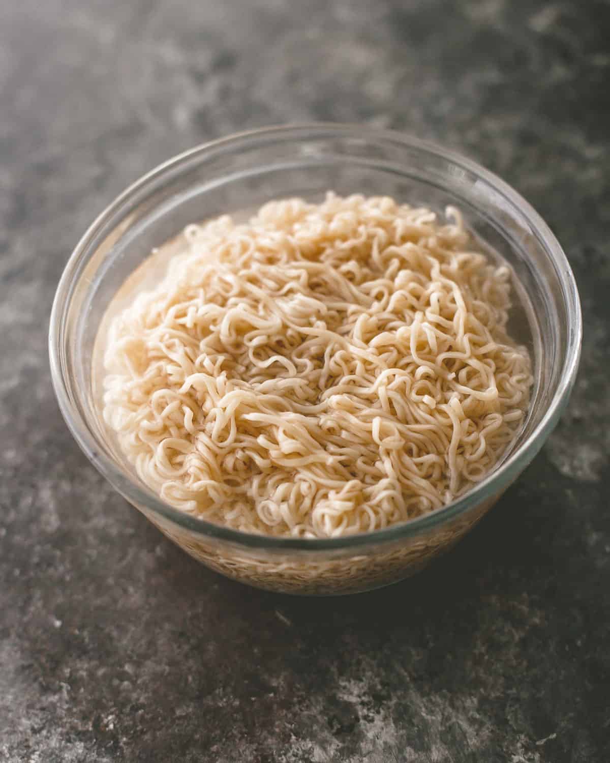 overhead image of cooked ramen noodles in a clear bowl