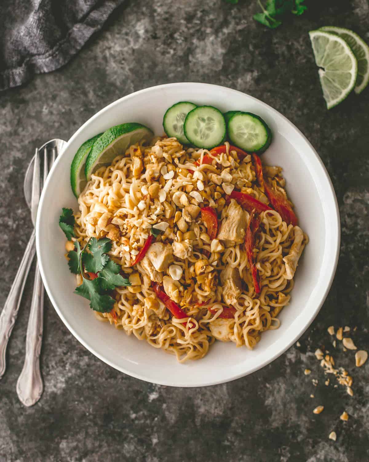 chicken noodles in a white bowl