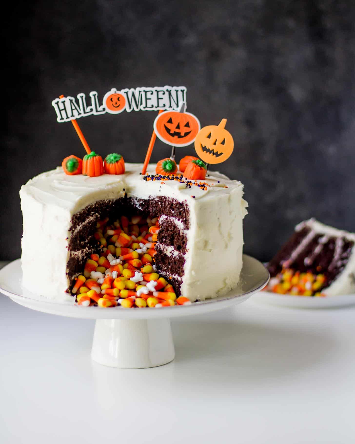 Halloween Pinata Cake on a white cake stand