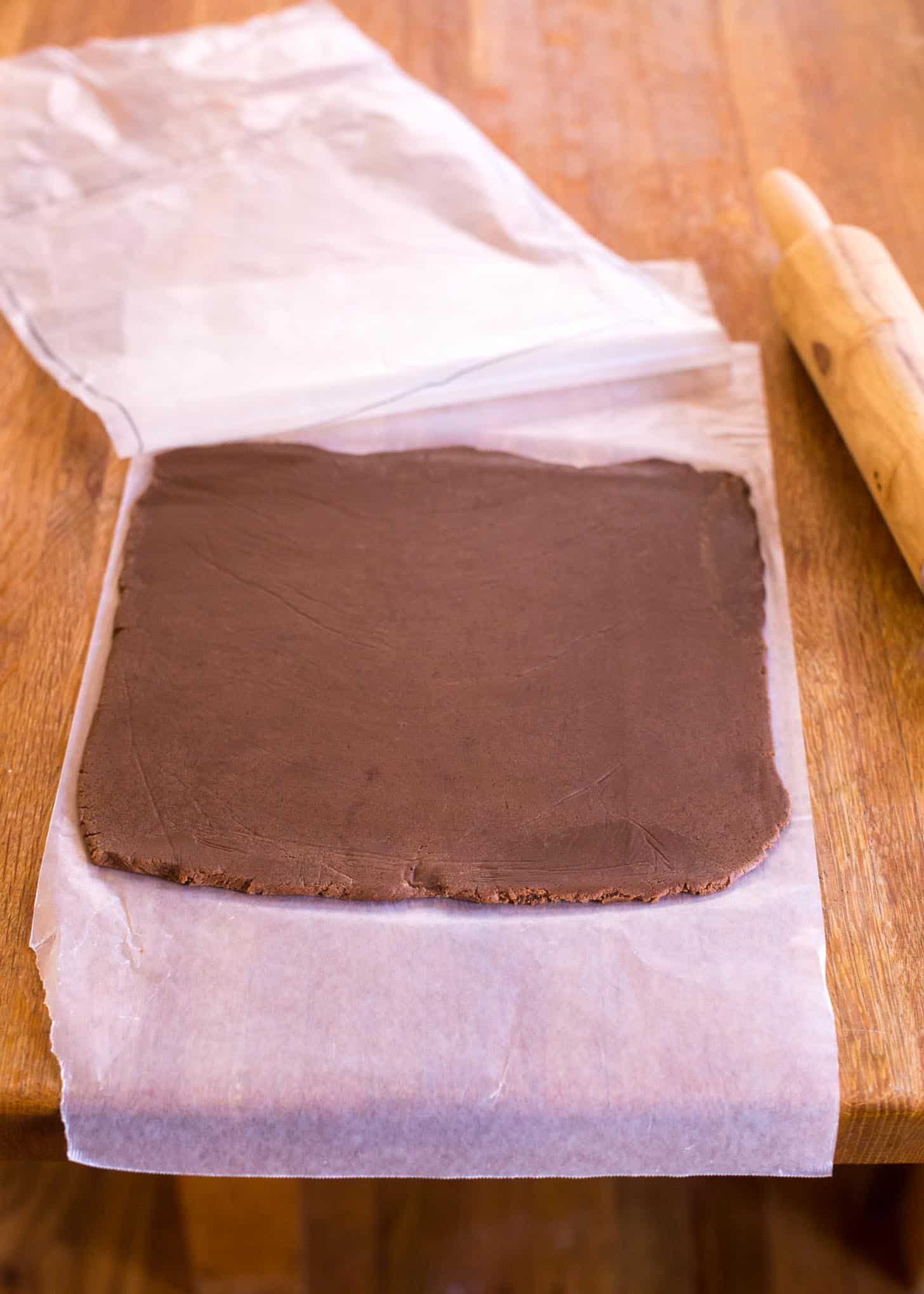 chocolate dough on a sheet of parchment paper