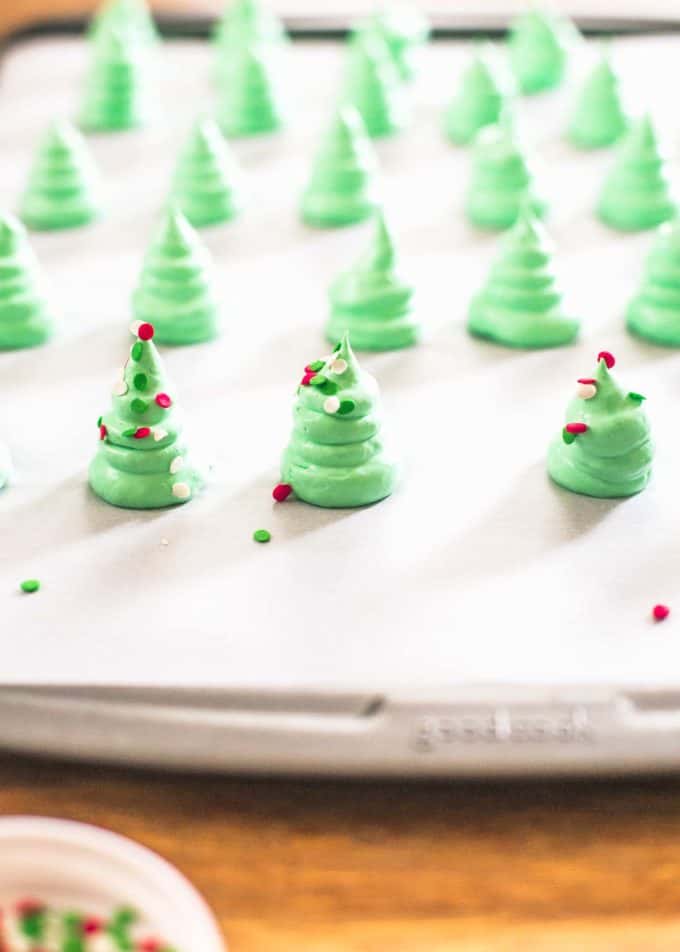 Christmas tree meringues on a sheet pan