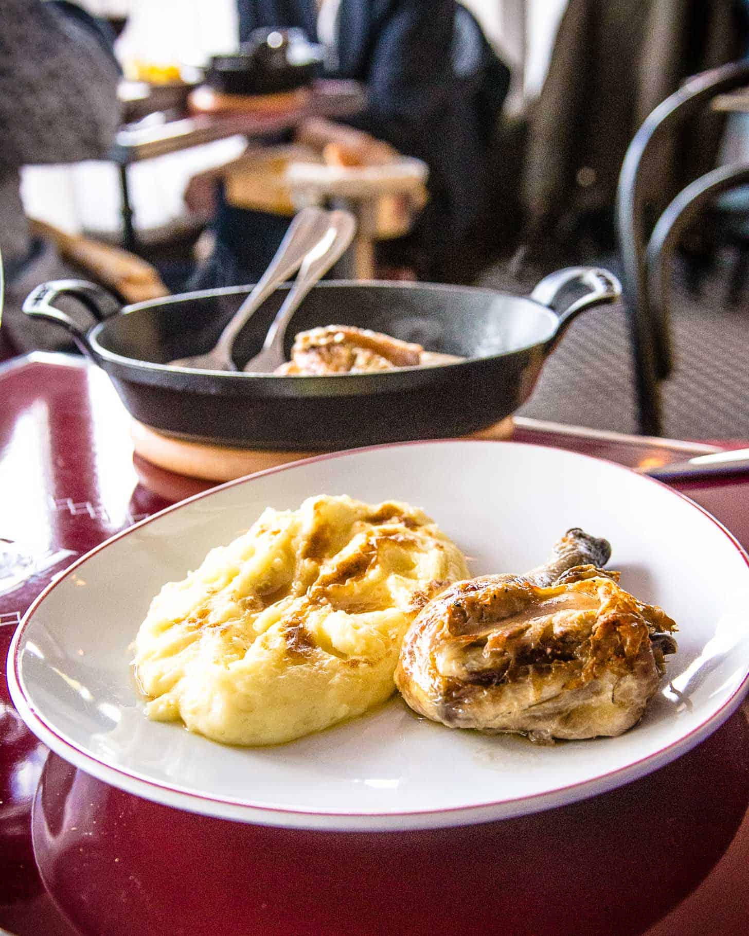 roast chicken and potatoes on a white plate