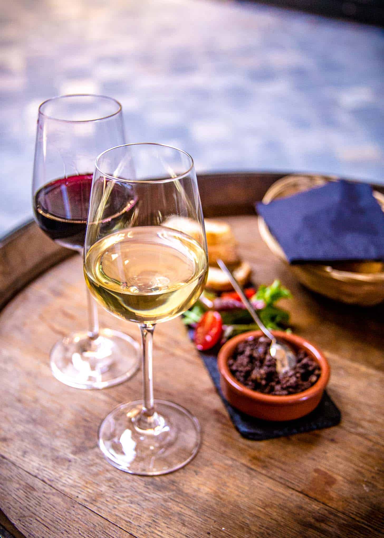 glasses of wine on a wooden table