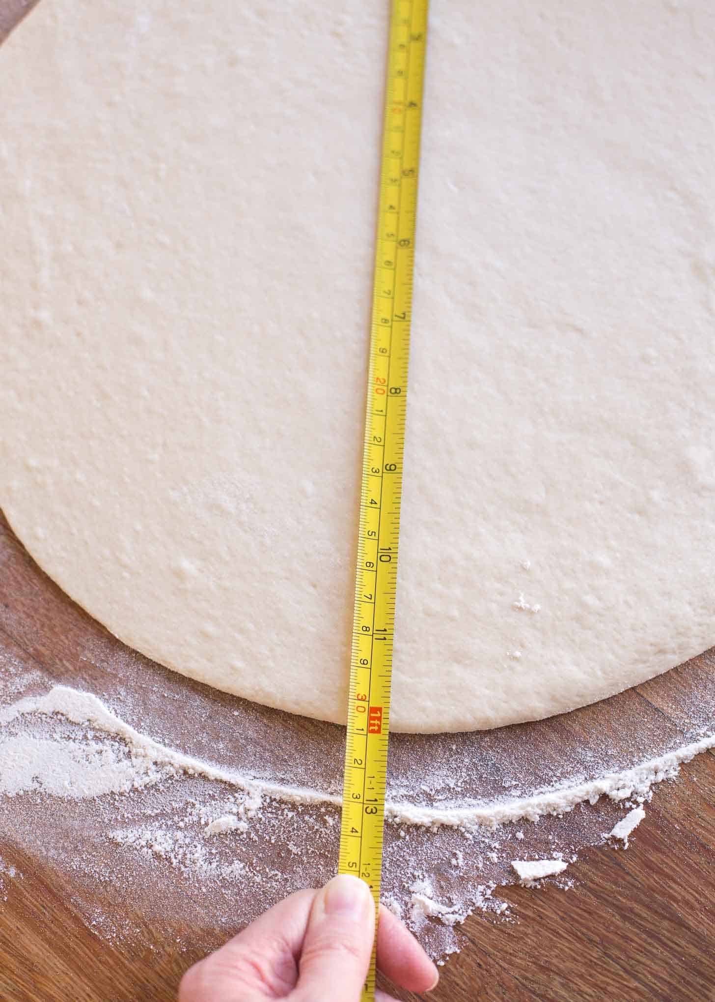 measuring dough circles for cinnamon star bread