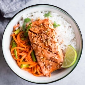 Lemongrass Salmon over rice in a white bowl