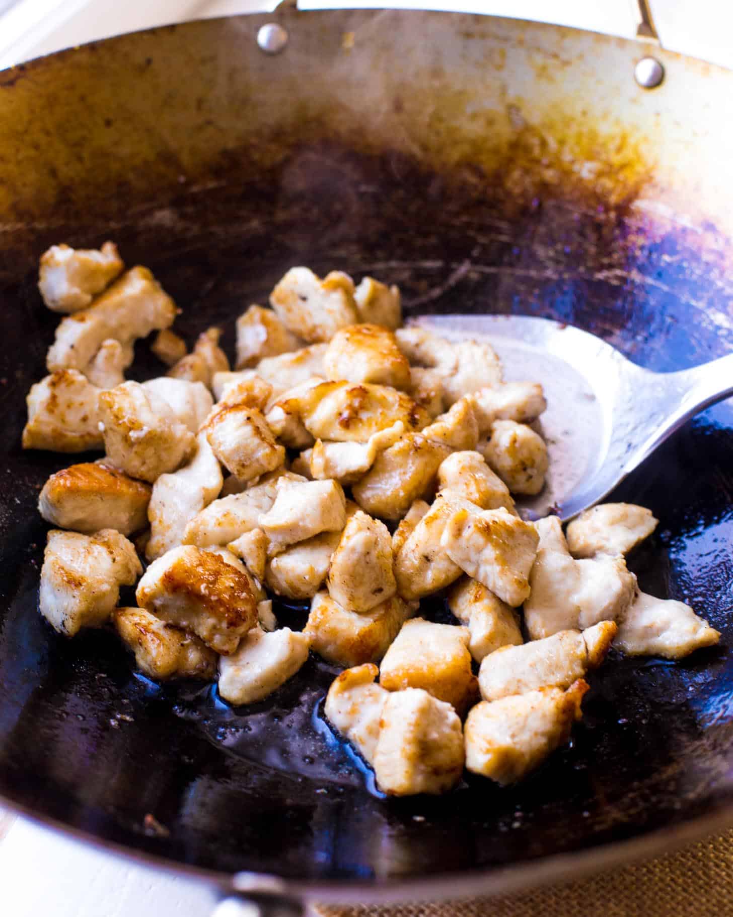 cooking chicken in a wok