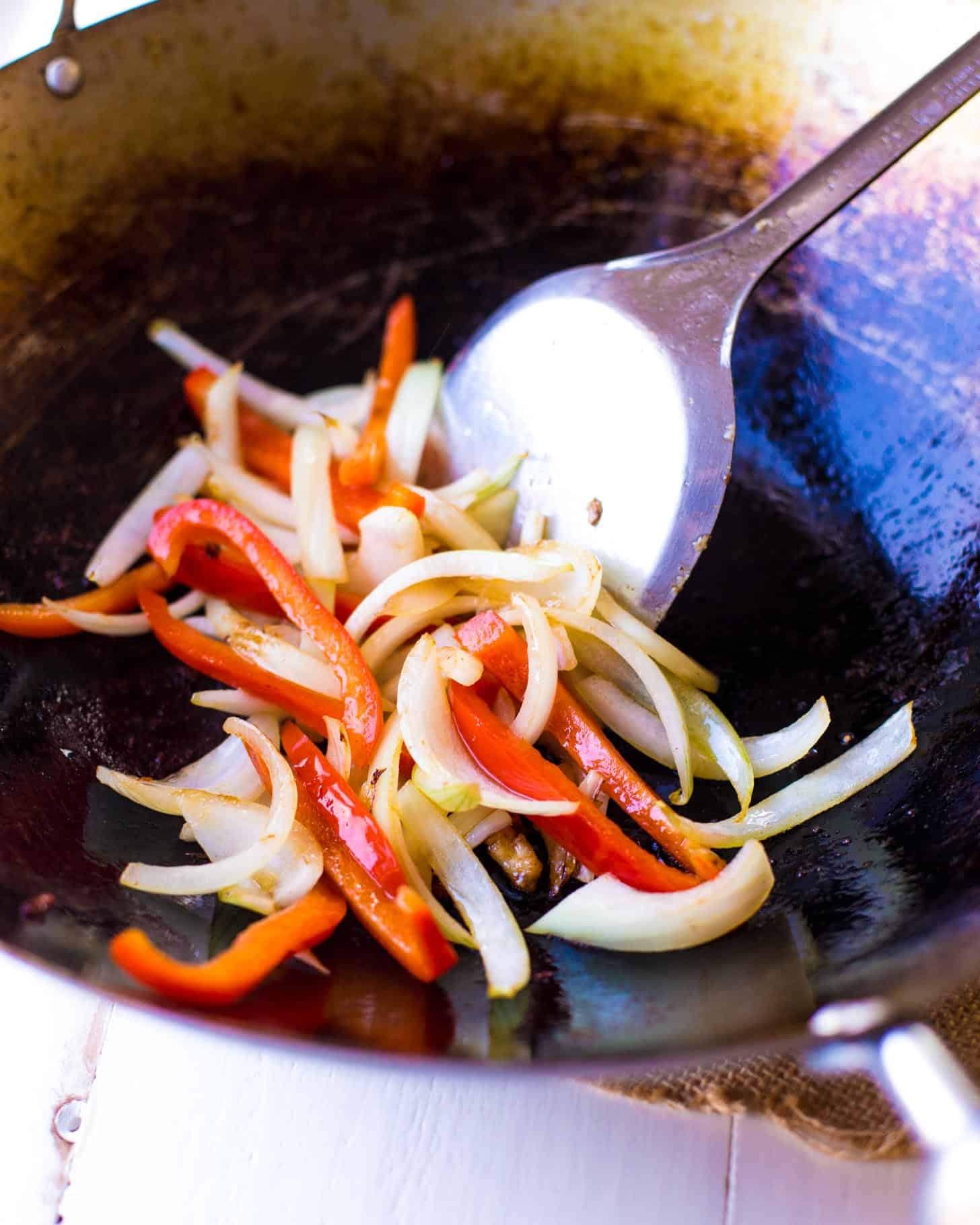 cooking vegetables in a wok